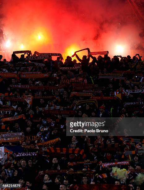 Roma fans support their team during the TIM Cup match between AS Roma and Juventus FC at Olimpico Stadium on January 21, 2014 in Rome, Italy.