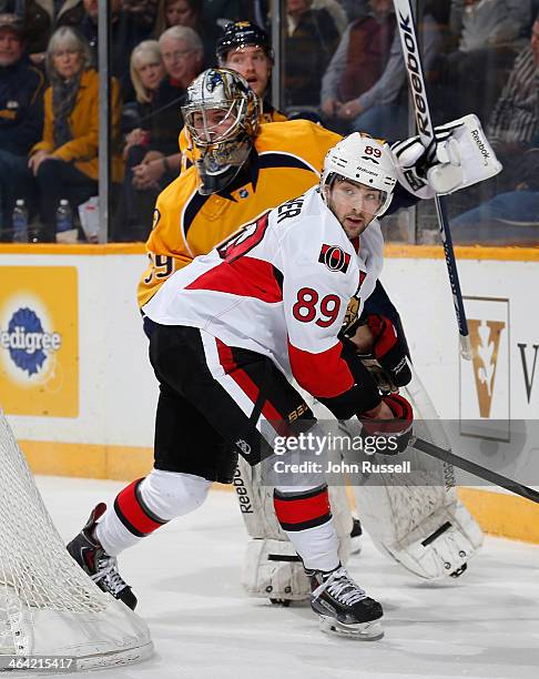 Cory Conacher of the Ottawa Senators skates against Marek Mazanec of the Nashville Predators at Bridgestone Arena on January 11, 2014 in Nashville,...