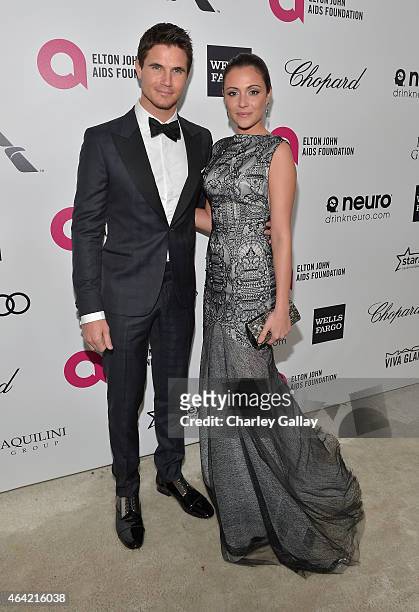Actors Robbie Amell and Italia Ricci attends Neuro at the 23rd Annual Elton John AIDS Foundation Academy Awards Viewing Party on February 22, 2015 in...