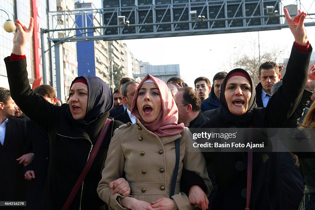 Protesters show the symbol of MHP with their fingers,...