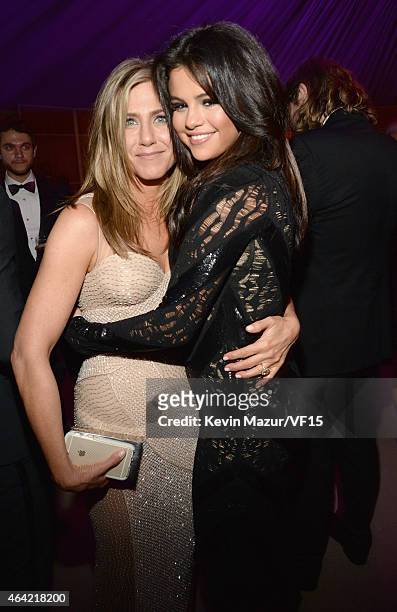Jennifer Aniston and Selena Gomez attend the 2015 Vanity Fair Oscar Party hosted by Graydon Carter at the Wallis Annenberg Center for the Performing...