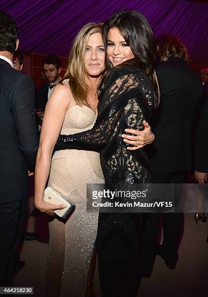 Jennifer Aniston and Selena Gomez attend the 2015 Vanity Fair Oscar Party hosted by Graydon Carter at the Wallis Annenberg Center for the Performing...