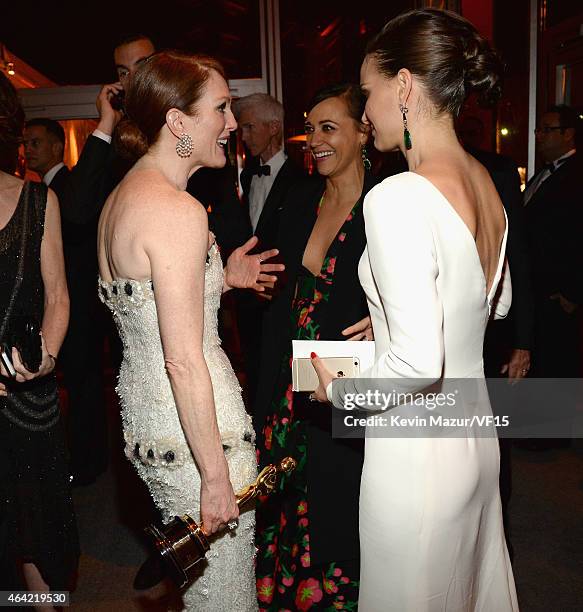 Natalie Portman, Julianne Moore and Rashida Jones attend the 2015 Vanity Fair Oscar Party hosted by Graydon Carter at the Wallis Annenberg Center for...