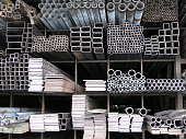 Various sizes steel rods and iron profiles stacked up