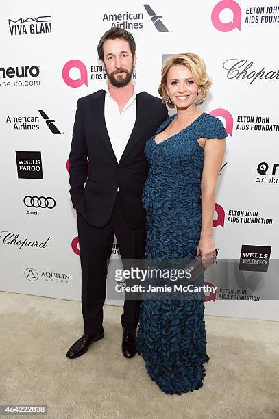 Actors Noah Wyle and Sara Wells attend the 23rd Annual Elton John AIDS Foundation Academy Awards Viewing Party on February 22, 2015 in Los Angeles,...