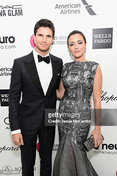Actors Robbie Amell and Italia Ricci attend the 23rd Annual Elton John AIDS Foundation Academy Awards Viewing Party on February 22, 2015 in Los...
