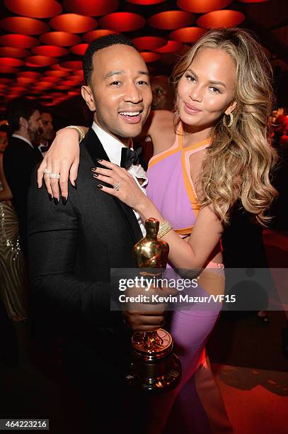 John Legend and Chrissy Teigen attend the 2015 Vanity Fair Oscar Party hosted by Graydon Carter at the Wallis Annenberg Center for the Performing...