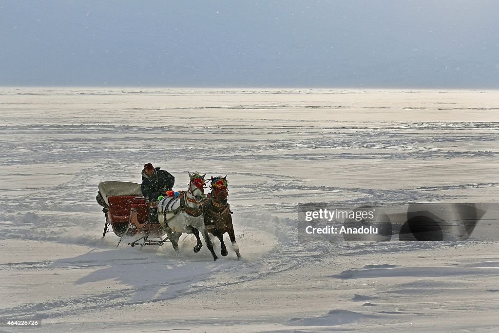 Horse drawn sleighs on ice over the Lake Cildir in Turkey
