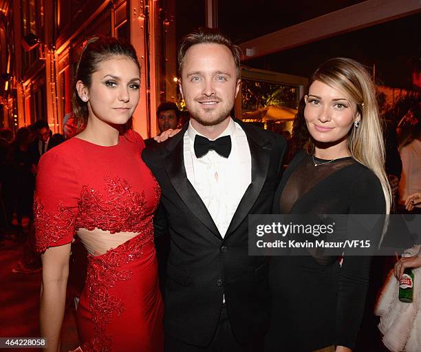 Nina Dobrev, Aaron Paul and Lauren Parsekian attend the 2015 Vanity Fair Oscar Party hosted by Graydon Carter at the Wallis Annenberg Center for the...