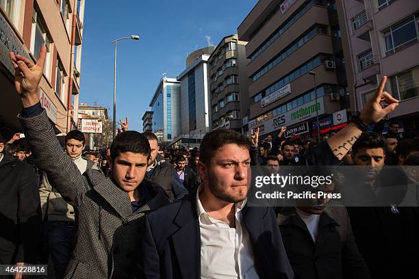 Two activists of Ülku Ocaklar give the wolf salute, while marching to commemorate slain student Frat Çakrolu, killed in a brawl among nationalists...