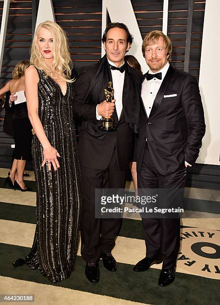 Janne Tyldum, composer Alexandre Desplat and director Morten Tyldum attend the 2015 Vanity Fair Oscar Party hosted by Graydon Carter at Wallis...