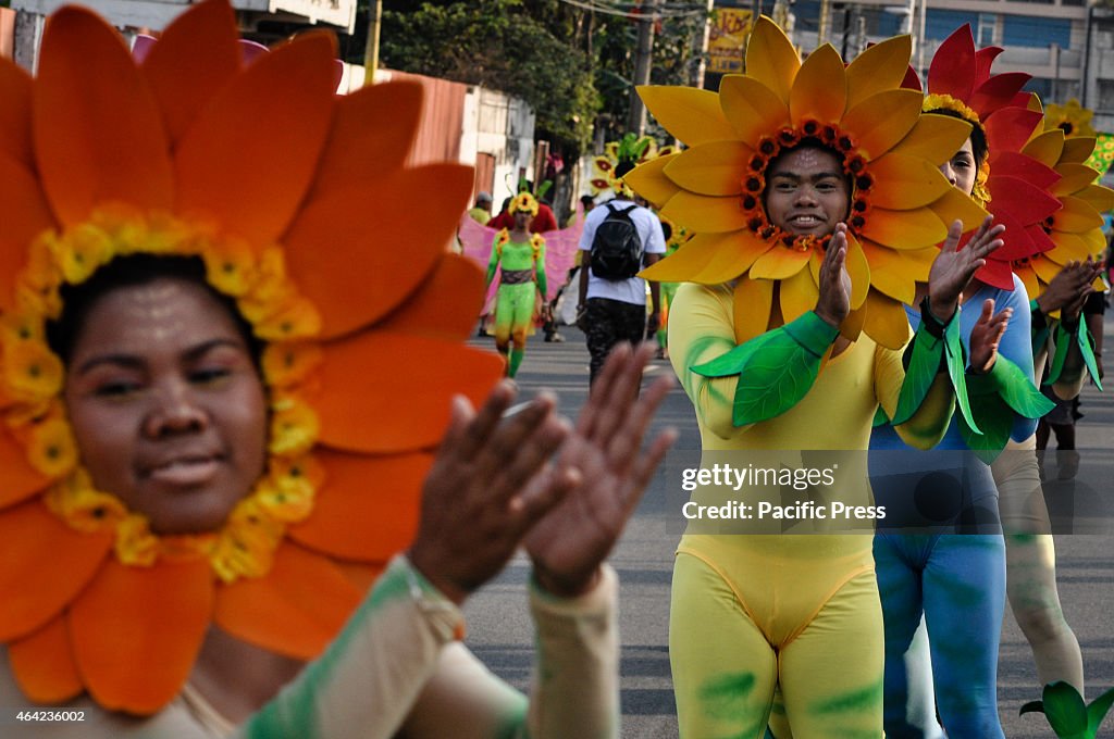 Performers in their colorful nature-inspired costume dance...