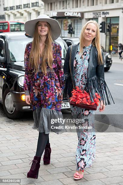 Presenter Katie Readman wears Matthew Williamson with a guest wearing Matthew Williamson on day 3 of London Collections: Women on February 22, 2015...