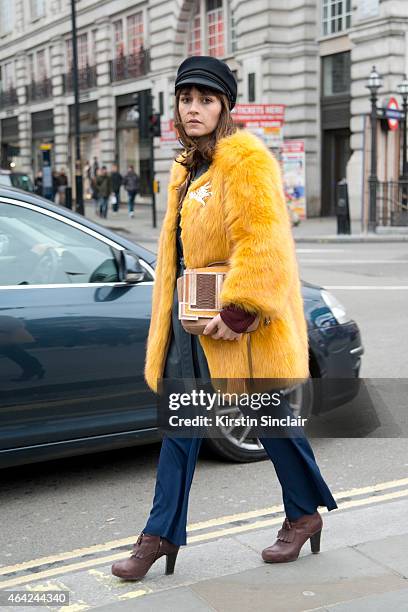 Photographer and Boutique owner Sara Reverberi wears vintage hat and jacket, Porta Mento shoes, JWo trousers, Raoul top and a Barbara Bonner bag on...