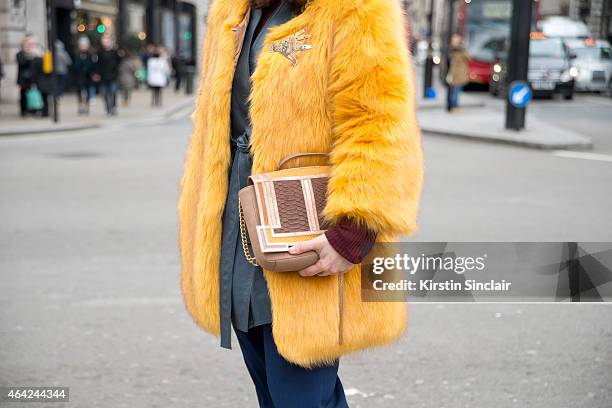 Photographer and Boutique owner Sara Reverberi wears vintage jacket, JWo trousers, Raoul top and a Barbara Bonner bag on day 3 of London Collections:...