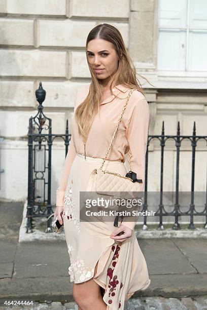 Model and DJ Amber Le Bon wears Palma Harding top and dress, Chanel handbag on day 3 of London Collections: Women on February 22, 2015 in London,...