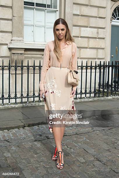 Model and DJ Amber Le Bon wears Palma Harding top and dress, Sophia Webster shoes and a Chanel handbag on day 3 of London Collections: Women on...