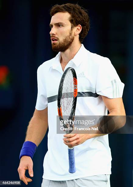 Ernests Gulbis of Latvia in looks on against Denis Istomin of Uzbekistan during day one of the ATP Dubai Duty Free Tennis Championships at the Dubai...