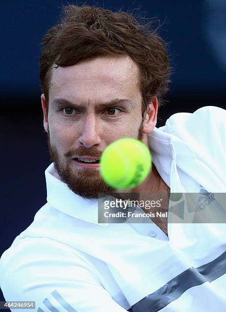 Ernests Gulbis of Latvia in action against Denis Istomin of Uzbekistan during day one of the ATP Dubai Duty Free Tennis Championships at the Dubai...