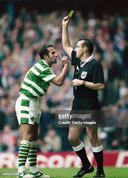 Celtic player Paolo Di Canio wags a finger at the referee after being booked during an Old Firm game at Ibrox on September 28, 1996 in Glasgow,...