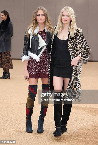 Cara Delevinge and Lily Donaldson attend the Burberry Prosum show during London Fashion Week Fall/Winter 2015/16 at perk's Field on February 23, 2015...
