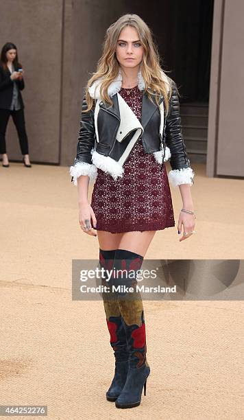 Cara Delevinge attends the Burberry Prosum show during London Fashion Week Fall/Winter 2015/16 at perk's Field on February 23, 2015 in London,...