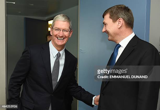 European Commission Vice-President and Commissioner for the Digital Single Market, Andrus Ansip greets Apple's Chief Executive Officer Tim Cook upon...