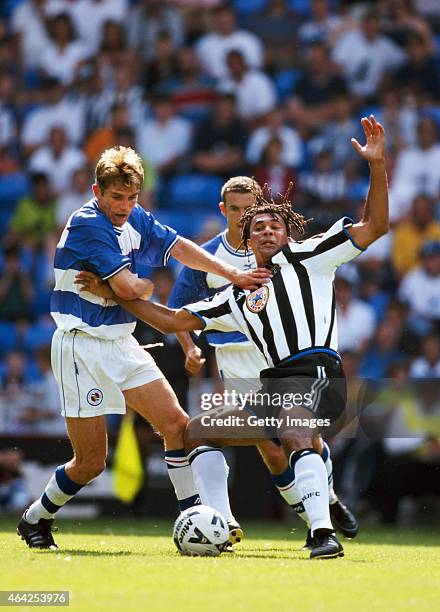 Reading player Phil Parkinson challenges Newcastle United manager Ruud Gullit, who had decided to play himself during a pre season friendly at the...