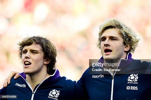 Brothers Jonny Gray and Richie Gray of Scotland line up for the national anthem prior to kickof during the RBS Six Nations match between Scotland and...
