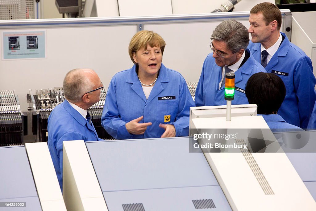 Germany's Chancellor Angela Merkel Visits Siemens AG Electronics Manufacturing Plant