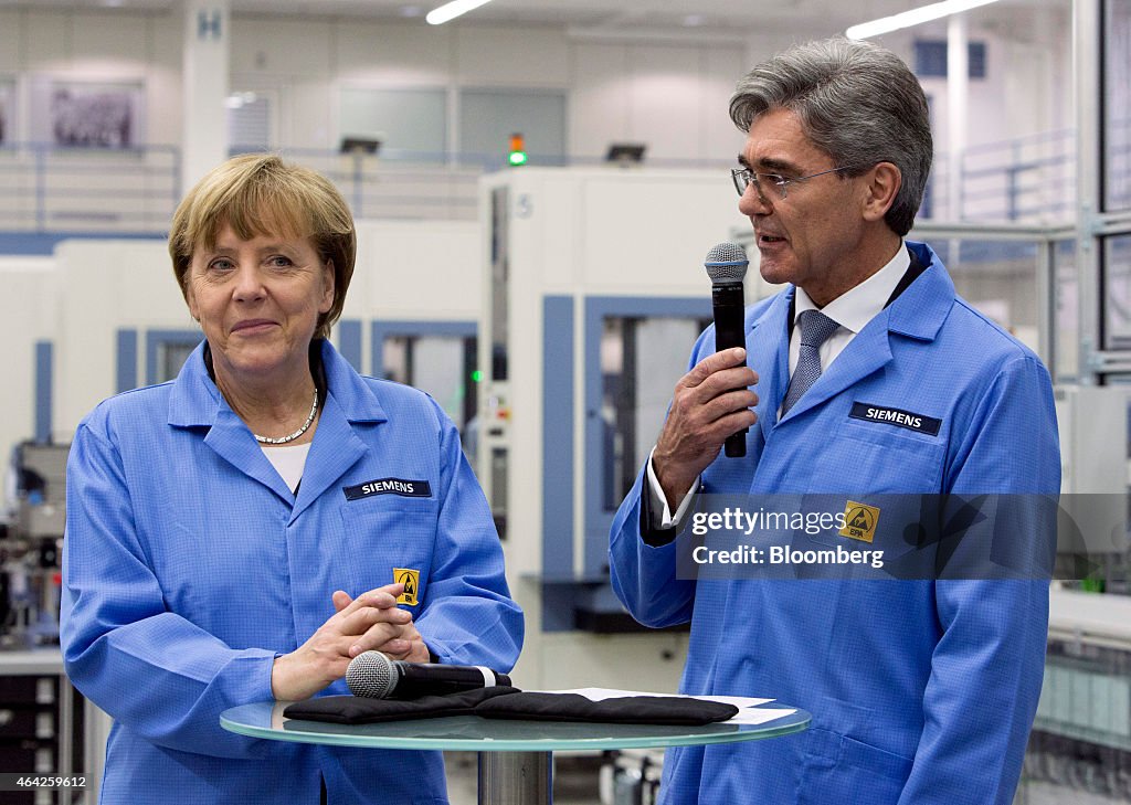 Germany's Chancellor Angela Merkel Visits Siemens AG Electronics Manufacturing Plant