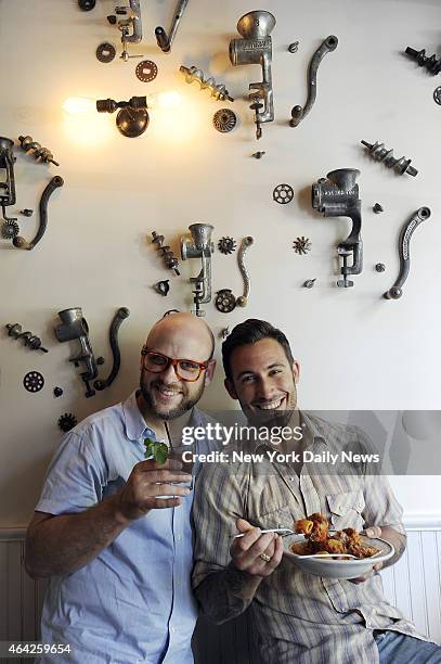 Michael Chernow and Daniel Holzman, co-owners of their new location of the Meatball Shop on Bedford Ave in Williamsburg, Brooklyn. They are in front...