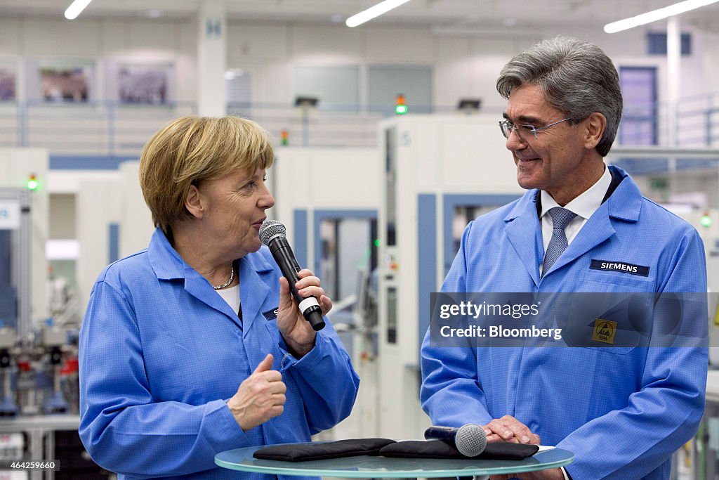 Germany's Chancellor Angela Merkel Visits Siemens AG Electronics Manufacturing Plant