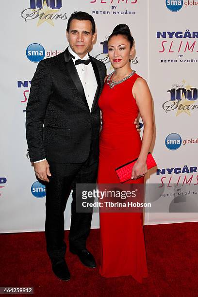Adrian Paul and Alexandra Tonelli attend the Norby Walters 25th annual night of 100 stars Oscar viewing gala at The Beverly Hilton Hotel on February...