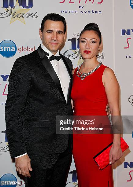 Adrian Paul and Alexandra Tonelli attend the Norby Walters 25th annual night of 100 stars Oscar viewing gala at The Beverly Hilton Hotel on February...