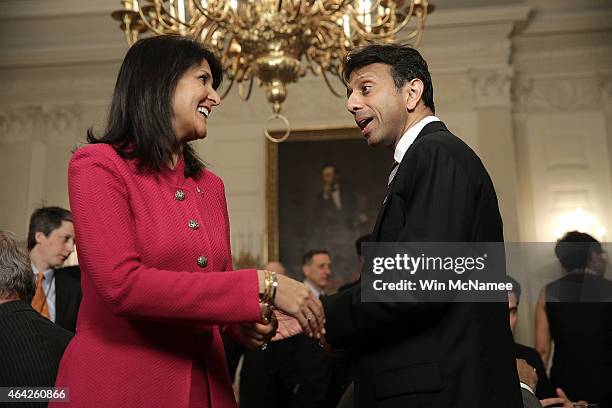 Louisiana Gov. Bobby Jindal talks with South Carolina Gov. Nikki Haley before U.S. President Barack Obama addressed members of the National Governors...