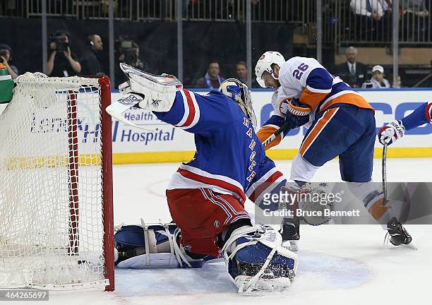 Thomas Vanek of the New York Islanders scores the game winning powerplay goal at 15:22 of the third period against Cam Talbot of the New York Rangers...