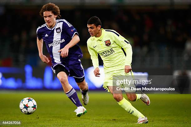 Mohamed El Ouriachi of Barcalona gets past Wout Faes of Anderlecht during the UEFA Youth League Round of 16 match between RSC Anderlecht and FC...