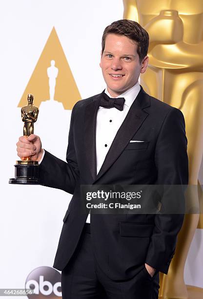 Writer Graham Moore poses in the press room during the 87th Annual Academy Awards at Loews Hollywood Hotel on February 22, 2015 in Hollywood,...