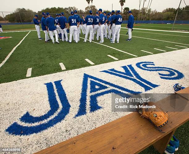 Pitchers and catchers get their instructions before heading to the diamonds at the practice facility of the Toronto Blue Jays 2015 spring training...