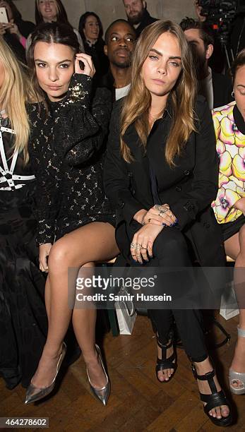 Emily Ratajkowski and Cara Delevingne attend at the GILES show during London Fashion Week Fall/Winter 2015/16 at Central Saint Martins on February...