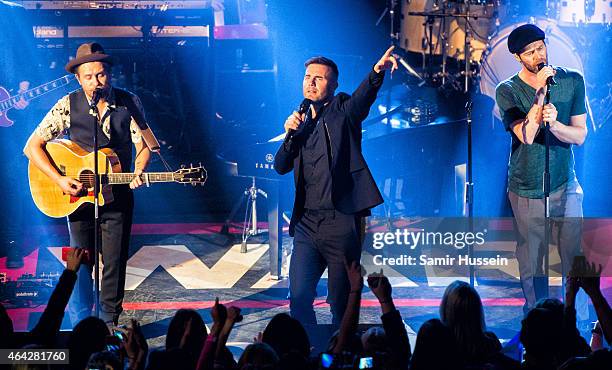 Mark Owen, Gary Barlow and Howard Donald of Take That perform on stage for the War Child BRITs show at O2 Shepherd's Bush Empire on February 23, 2015...