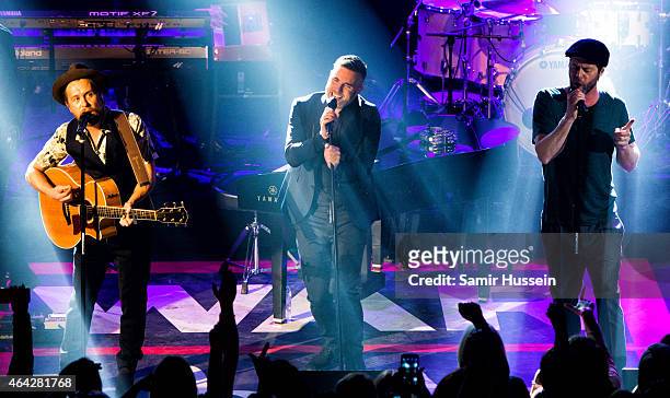 Mark Owen, Gary Barlow and Howard Donald of Take That perform on stage for the War Child BRITs show at O2 Shepherd's Bush Empire on February 23, 2015...