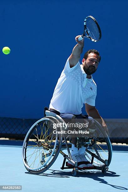 Michael Jeremiasz of France plays a forehand in his quarterfinal wheelchair singles match against Gustavo Fernandez of Argentina during day 10 of the...