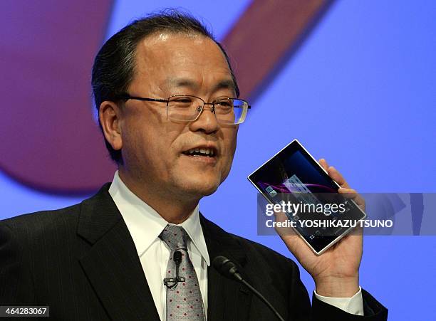 Takashi Tanaka, president of Japanese mobile communication company KDDI displays their new smartphone "Xperia Z Ultra", produced by Japanese...