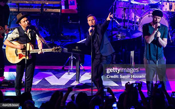 Mark Owen, Gary Barlow and Howard Donald of Take That perform on stage for the War Child BRITs show at O2 Shepherd's Bush Empire on February 23, 2015...