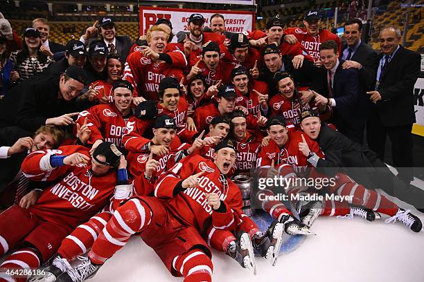 The Boston University Terriers celebrate their win over the Northeastern Huskies 4-3 during overtime in 2015 Beanpot Tournament Championship game at...