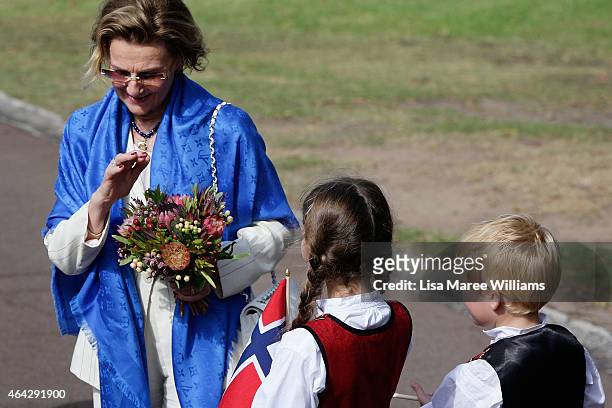 Queen Sonja of Norway receives flowers as she arrives at Kirribilli on February 24, 2015 in Sydney, Australia. The royal couple are in Australia for...