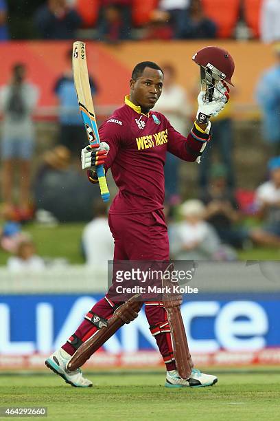 Marlon Samuels of West Indies celebrates his century during the 2015 ICC Cricket World Cup match between the West Indies and Zimbabwe at Manuka Oval...