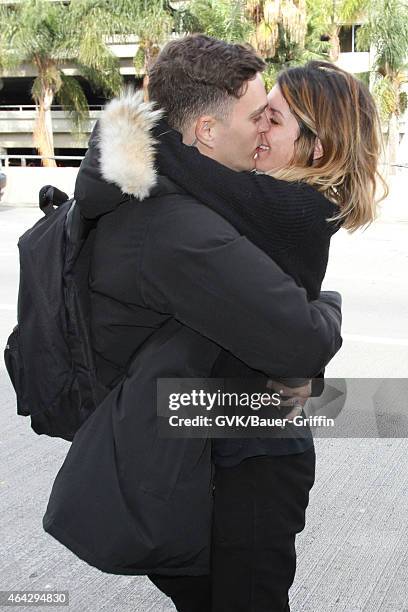 Shenae Grimes and Josh Beech seen at LAX on February 23, 2015 in Los Angeles, California.